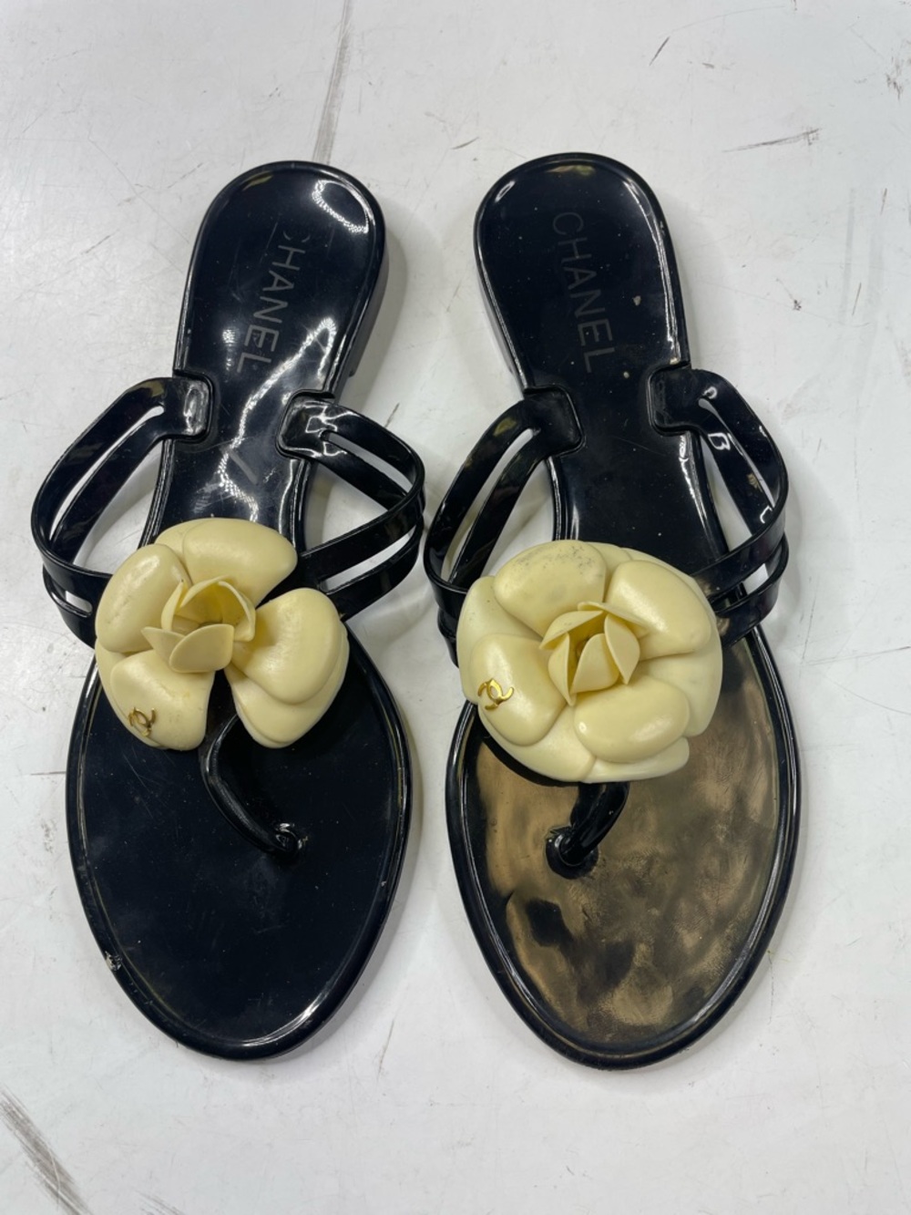 CHANEL Black Jelly Thong Sandals with Cream Camellia Flower